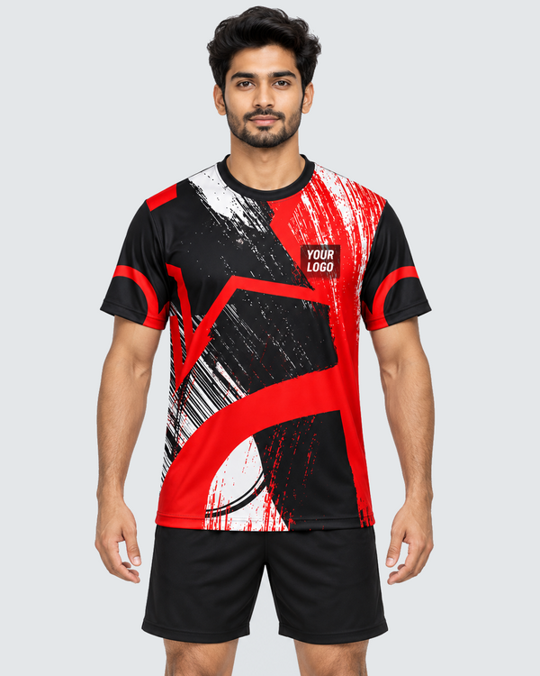 Front view of crimson brushstroke custom sports jersey on an Indian male model with plain black shorts
