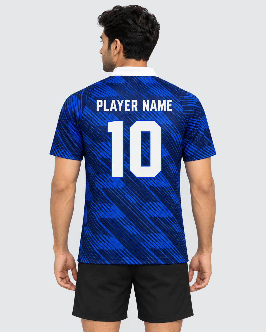 Back 4:5 view of royal blue diagonal brushstroke collared sports jersey with PLAYER NAME and number 10, modeled with plain black shorts on a light grey background
