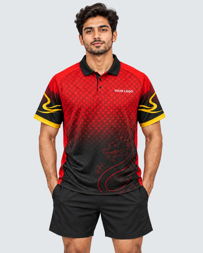 Front model photo of red and black dragon-inspired polo sports jersey with gold sleeve accents, YOUR LOGO chest placeholder, and plain black sports shorts