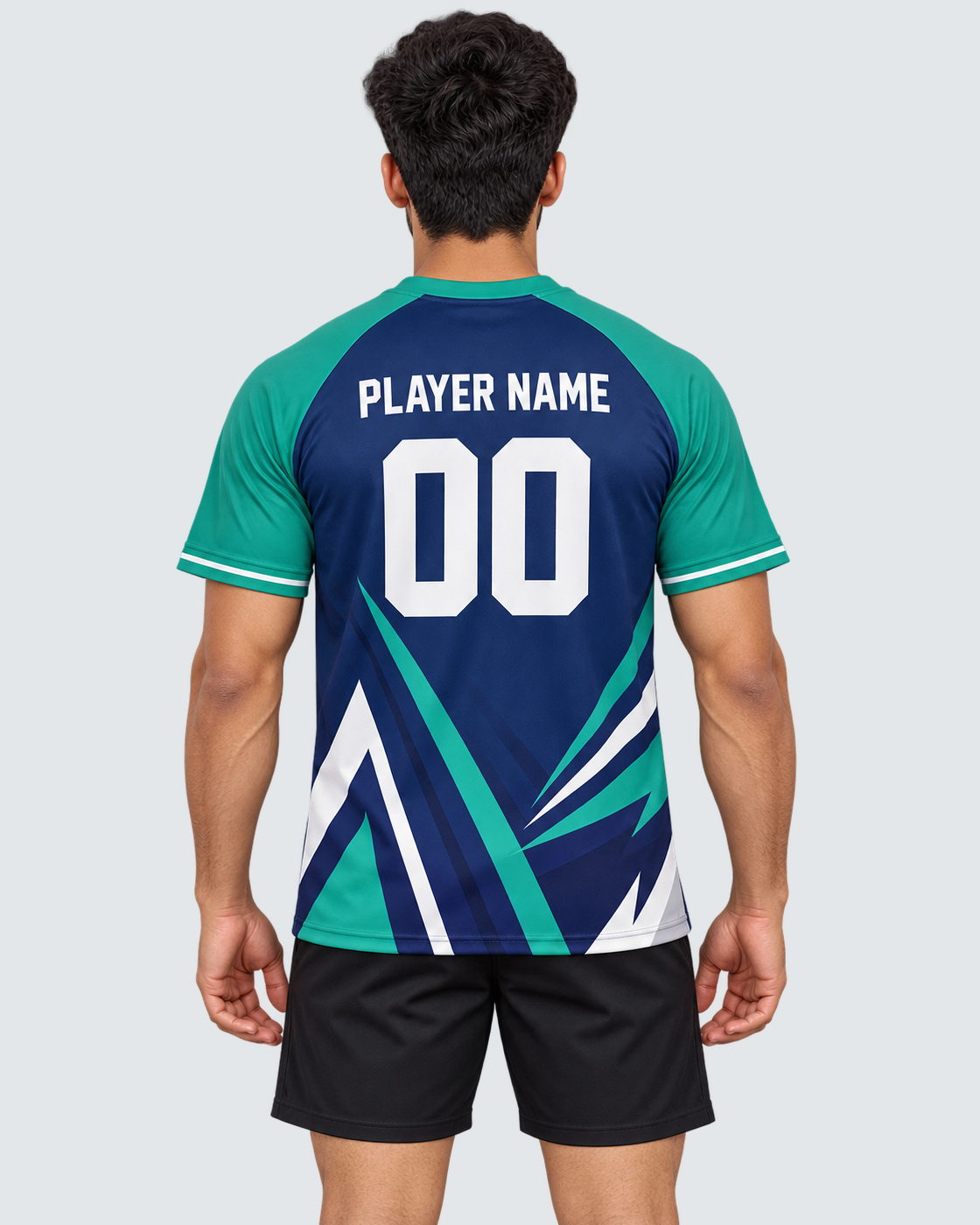 Back model photo of a navy and teal geometric sports jersey with PLAYER NAME and number 00, worn with plain black sports shorts