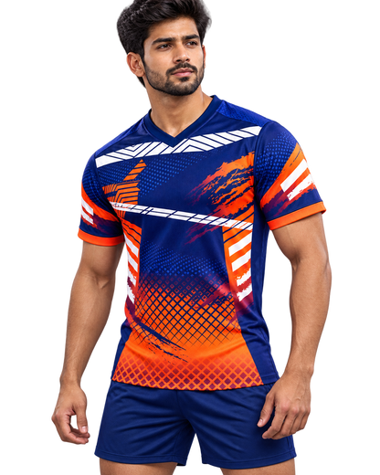 Three quarter front view of navy and orange sports jersey on model with plain navy shorts