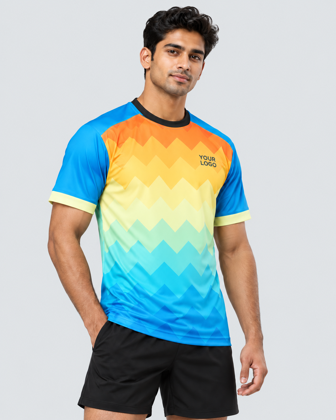 Three-quarter view of the orange, golden-yellow, mint, and cyan chevron sports jersey with a black collar on one model wearing plain black sports shorts