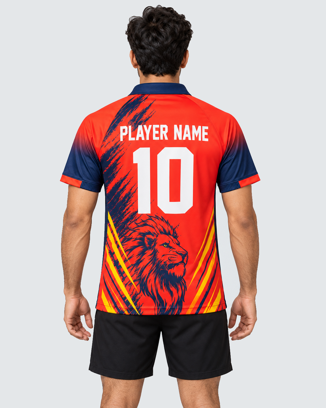 Back view: red, navy and yellow sports jersey with PLAYER NAME and number 10; black shorts; solid #E4E7E9 background