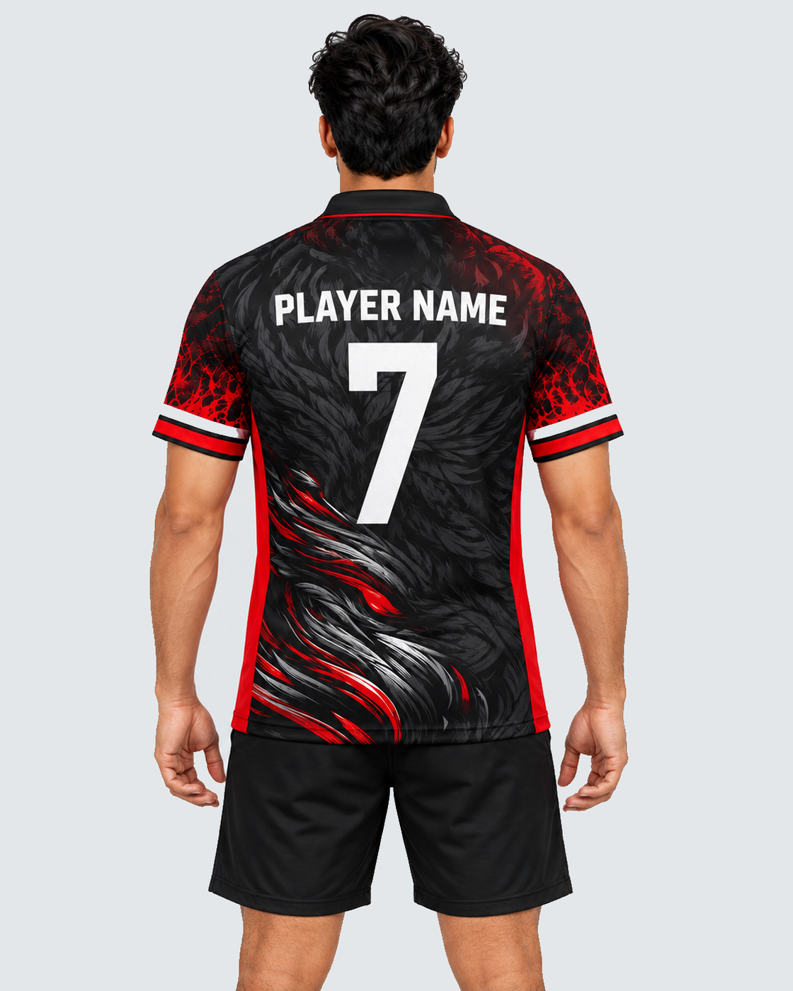 Back model view of black and red sports jersey with PLAYER NAME and number 7, black shorts and solid #E4E7E9 background