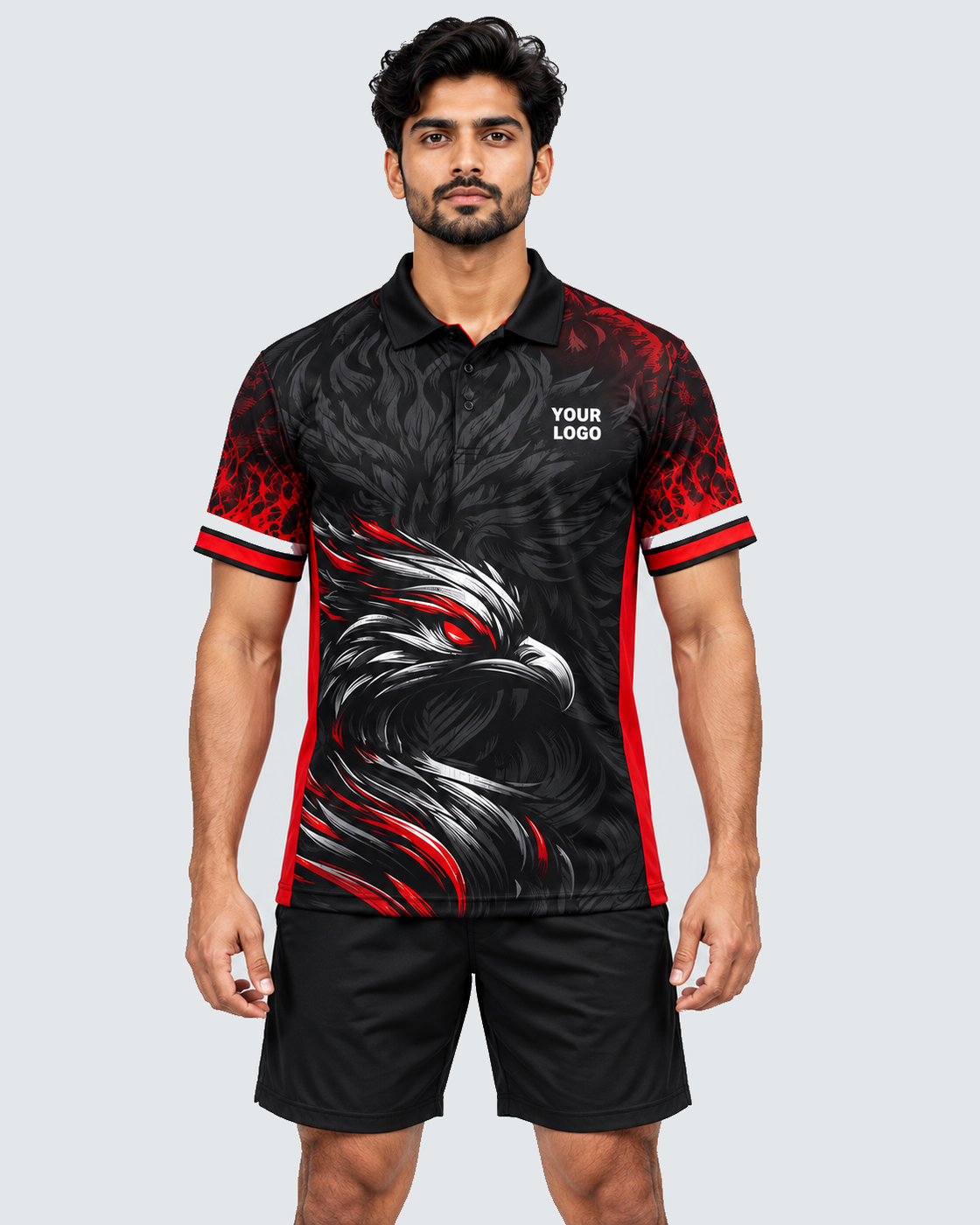 Front model view of black and red eagle feather sports jersey with YOUR LOGO, black shorts and solid #E4E7E9 background