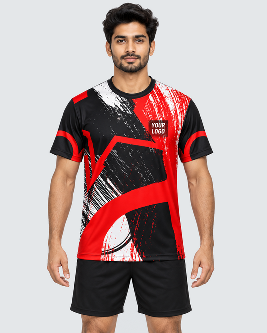 Front view of crimson brushstroke custom sports jersey on an Indian male model with plain black shorts