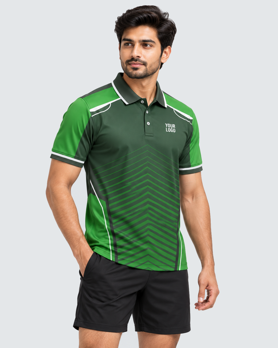 Angled model view of evergreen chevron polo sports jersey with plain black shorts, solid #E4E7E9