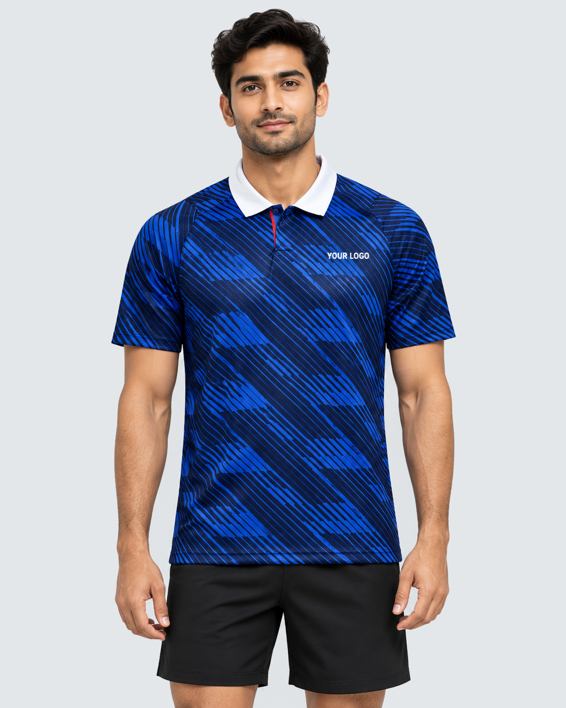 Front 4:5 view of royal blue diagonal brushstroke collared sports jersey with YOUR LOGO, modeled with plain black shorts on a light grey background