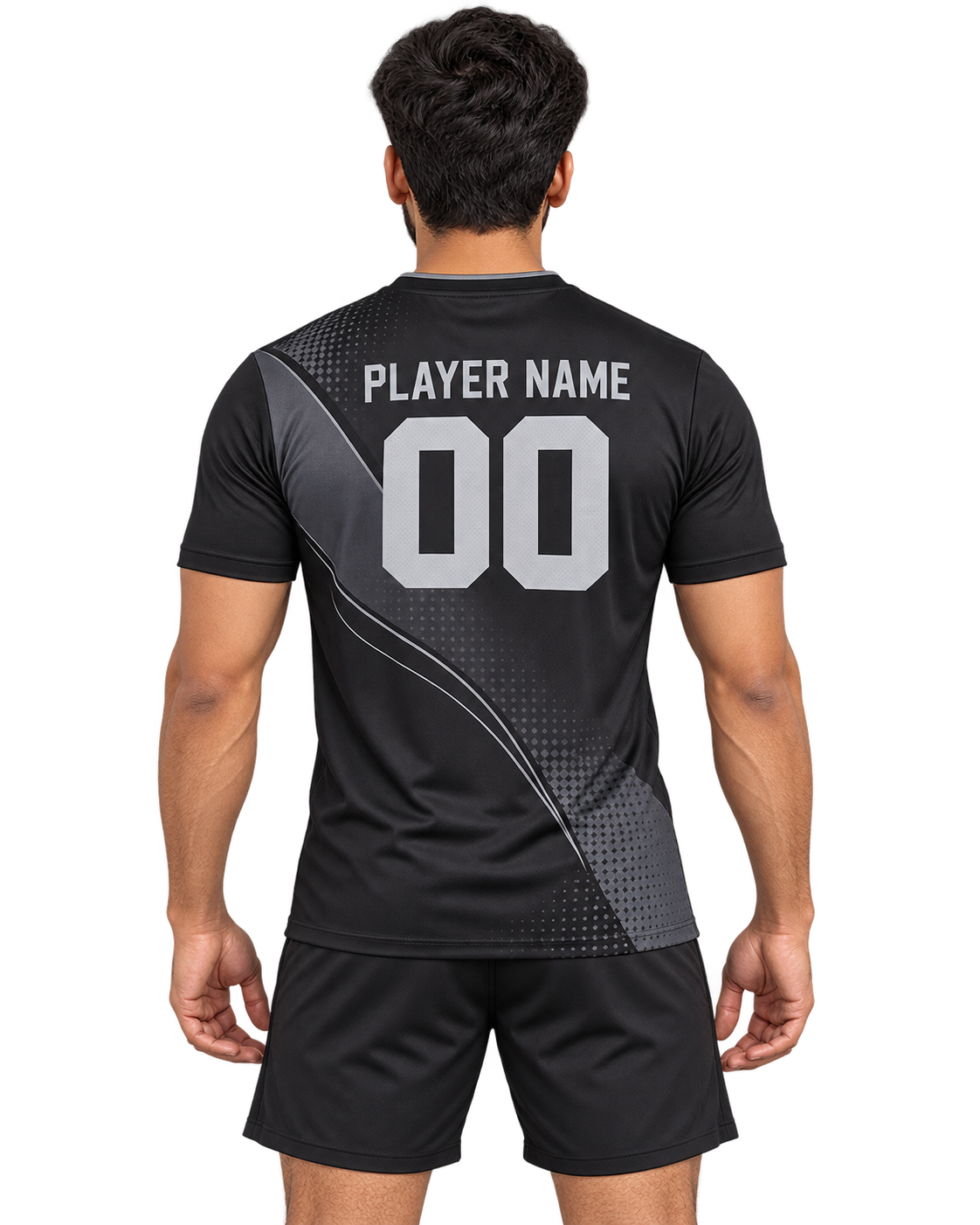 Indian male model wearing the Graphite Arc black and graphite sports jersey with plain black shorts, back view with player name and number