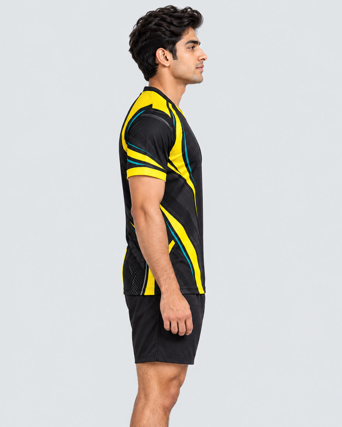 Right side profile of Indian model wearing the Volt Strike jersey