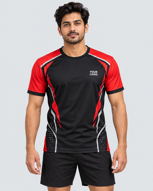 Front view: Indian model wearing black and red custom sports jersey with YOUR LOGO chest placeholder