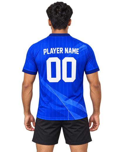 Indian male model wearing the Royal Facet royal-blue V-neck sports jersey with plain black athletic shorts, back view with player name and number