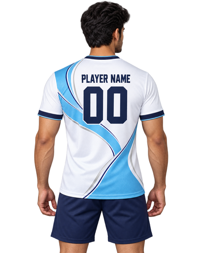 Indian male model wearing the Sky Ribbon white and sky-blue crew-neck sports jersey with plain navy shorts, back view with player name and number