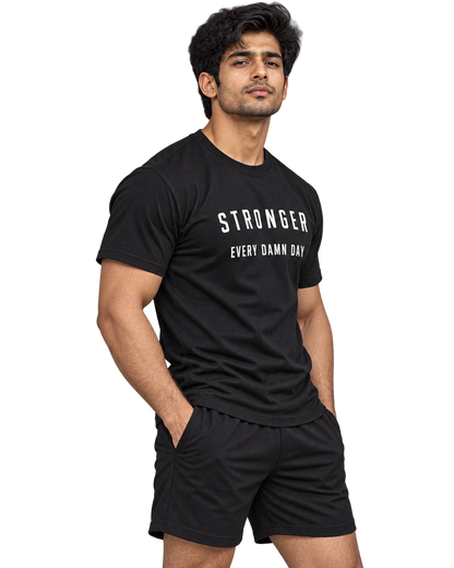 SWANKYFY Stronger Every Damn Day regular fit cotton T-shirt black-side, natural DTF print, Indian model transparent background