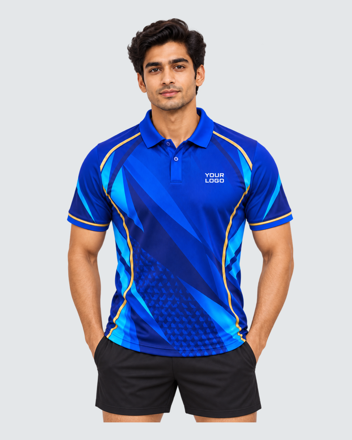 Cobalt Motion, Front view with YOUR LOGO chest placement; Indian male model, black sports shorts, solid #E4E7E9 background, portrait 4:5