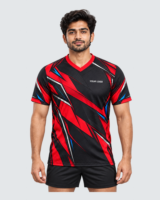 Crimson Flux, Front view with YOUR LOGO chest placement; Indian male model, black sports shorts, solid #E4E7E9 background, portrait 4:5