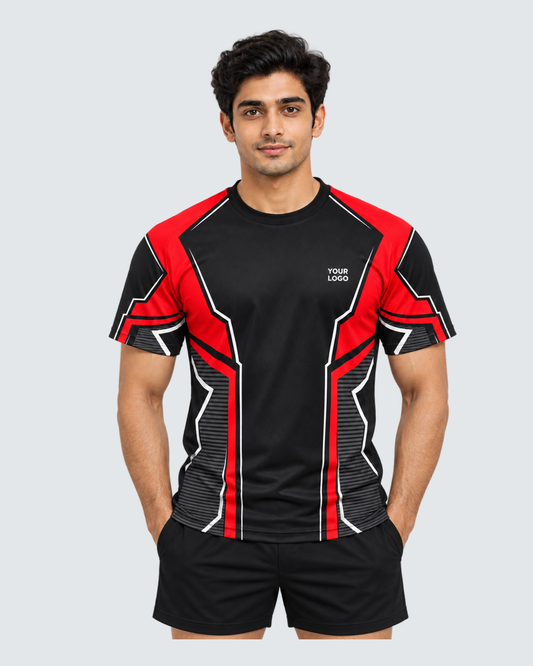 Crimson Frame, Front view with YOUR LOGO chest placement; Indian male model, black sports shorts, solid #E4E7E9 background, portrait 4:5
