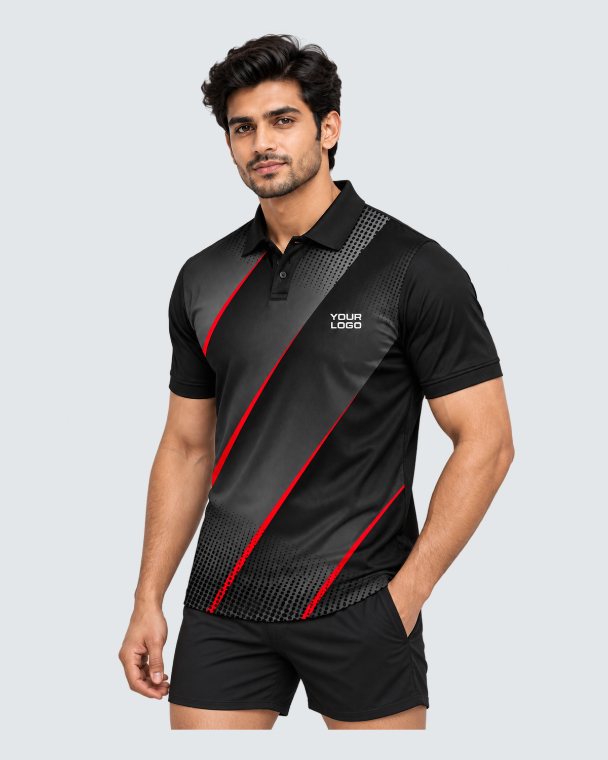 Obsidian Rush, Three-quarter front view; Indian male model, black sports shorts, solid #E4E7E9 background, portrait 4:5